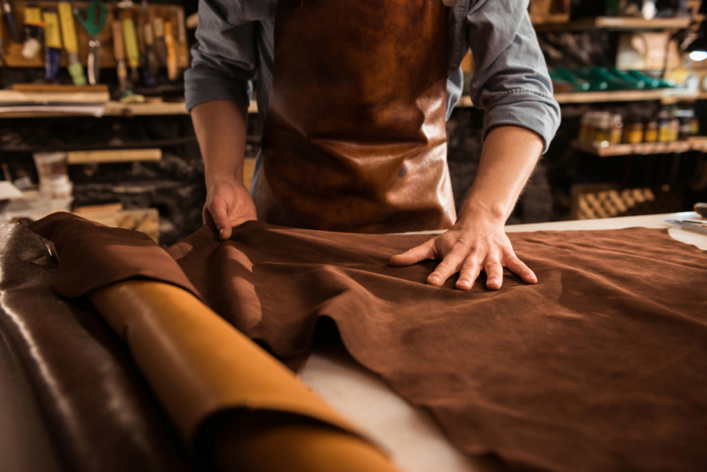 close-up-of-a-cobbler-working-with-leather-textile.jpg